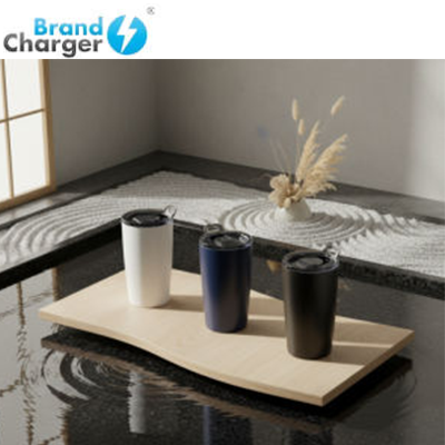 BrandCharger Brew Vacuum Tumbler collection showcased on a wooden surface with decorative elements.