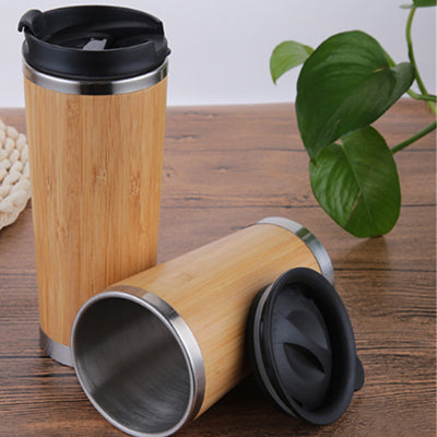 Eco Friendly Bamboo Insulated Vacuum Flask displayed alongside a lid, showcasing its bamboo and stainless steel design.