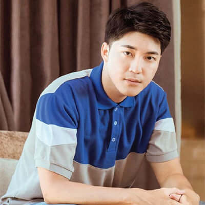 North Harbour 2900 Adley Polo T-Shirt worn by a man, showcasing its stylish design and comfort.