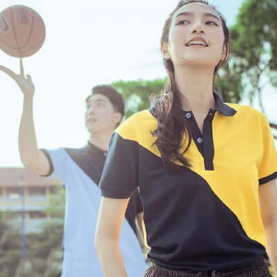 North Harbour 2100 Georgia Polo T-Shirt featured on model playing basketball outdoors.