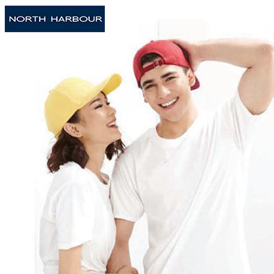 North Harbour 1100 Baseball Cap worn by a couple during an outdoor activity, showcasing style and comfort.