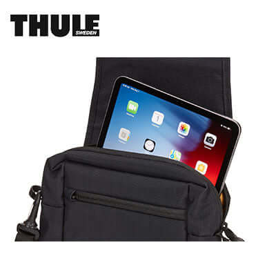 Thule Paramount Crossbody Bag with tablet in padded compartment showcasing its stylish design and functionality.