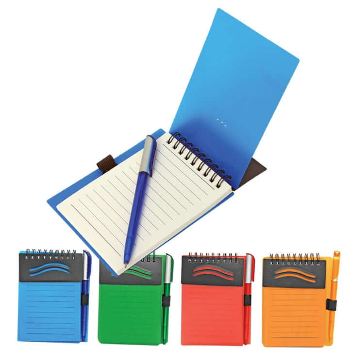 Plastic Notebook With Pen in blue, green, red, and orange colors, ideal for corporate gifts and portable note-taking.