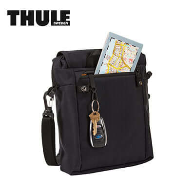 Thule Paramount Crossbody Bag featuring a map and keys for modern lifestyles and security.