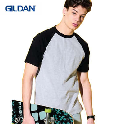 Gildan Adult Unisex Raglan T-Shirt worn by a young man with a skateboard, perfect for casual wear or corporate gift.