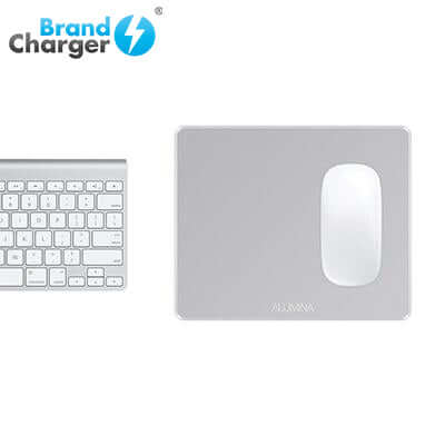BrandCharger Alumina Aluminium Mouse Pad next to a silver keyboard, perfect for any workspace.
