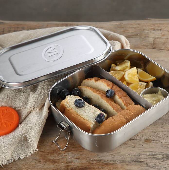 Stainless Steel Food Container Lunch Box with Compartment filled with food, featuring removable dividers and a leakproof lid.