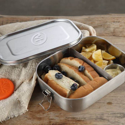 Stainless Steel Food Container Lunch Box with Compartment filled with food, featuring removable dividers and a leakproof lid.