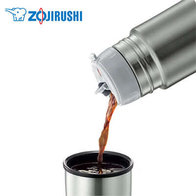 ZOJIRUSHI Elegant 0.5L Stainless Steel Flask SV-GR50 pouring hot beverage into a cup.