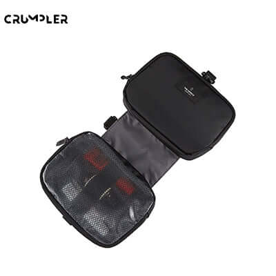 Crumpler Spritz Dopp Kit Toiletry Bag opened showcasing its sleek design and mesh pocket for travel essentials.