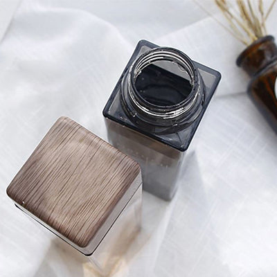 BPA Free Square Water Bottle with Bamboo Lid 500ml showcasing a modern square design and eco-friendly bamboo lid.