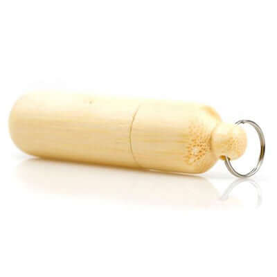 Cylinder-shaped Wooden USB Drive made from Bamboo with a keyring and natural wood finish.