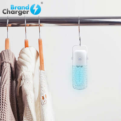 BrandCharger Portable UV Germicidal Lamp hanging near clothing for effective disinfection.