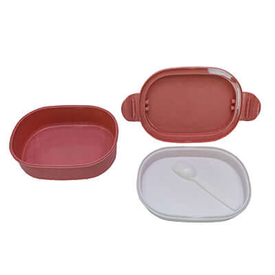 Oval Wheat Fiber Lunch Box with spoon in pink and white colors, eco-friendly meal storage solution.