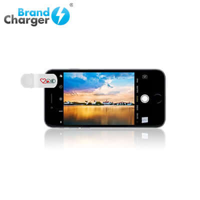 BrandCharger Lenso Smartphone Clip on Photography lens attached to an iPhone, showcasing enhanced photography capabilities.