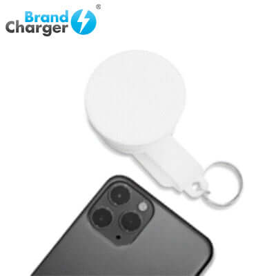 BrandCharger Smartphone Lumi Lightbulb shown with smartphone, ideal for corporate gift use.