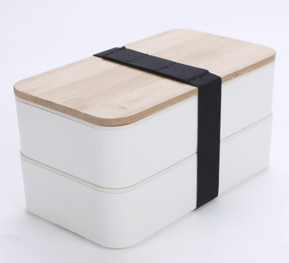 2-tier Lunchbox with Cutlery Set and Bamboo lid, stylish beige design with bamboo lid and black strap.