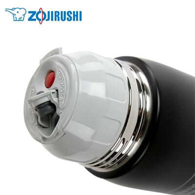 Close-up of ZOJIRUSHI Stainless Thermal Bottle with Cup 1.03L lid, showcasing innovative design and functionality.
