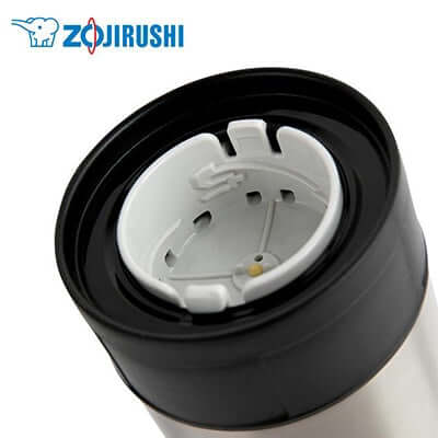 Close-up view of the lid design of ZOJIRUSHI Stainless Steel Vacuum Food Jar, featuring removable components and user-friendly features.