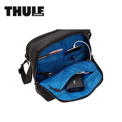 Thule Crossover 2 Crossbody Tote Sling Bag interior featuring organized pockets and cord management system.