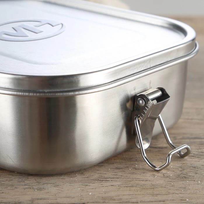 Stainless Steel Food Container Lunch Box with Compartment featuring a secure locking clip and durable design.