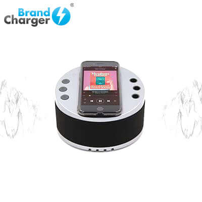 BrandCharger LYNQ Desktop Holder with Speaker and USB Hub showcasing a phone on a Bluetooth speaker.