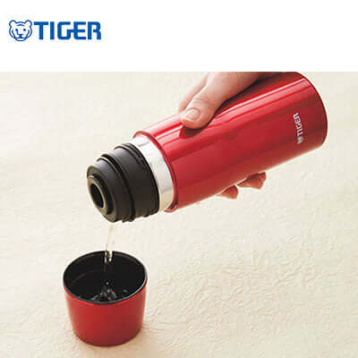 Tiger Stainless Steel Thermal Bottle MJD-A pouring hot beverage into cup, perfect corporate gift.