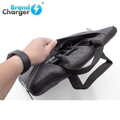 BrandCharger Specter high quality laptop bag being held, showcasing its sleek design and functional interior.