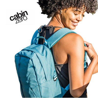 A woman wearing the Cabinzero Classic Flight Backpack 12L, showing its compact design and durability.