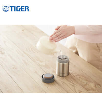 Tiger Wide Mouth Stainless Steel Bottle MCA-C being filled, ideal for hydration and corporate gifts.