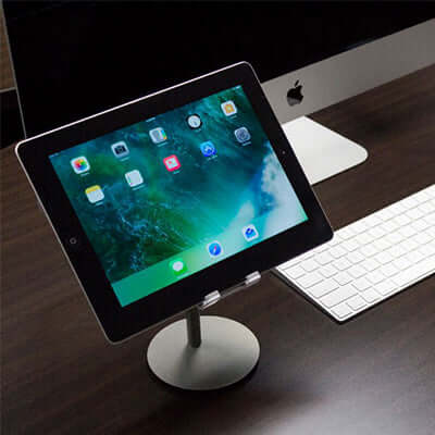 BrandCharger Rise Phone Stand on a desk supporting a tablet, ideal for corporate gifts and stylish functionality.