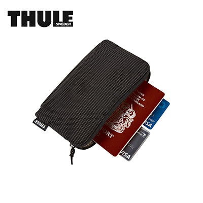 Thule Crossover 2 Multi-Purpose Travel Organizer with passport and credit cards inside.