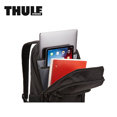 Thule Achiever 22L Laptop Backpack showing storage for laptop and tablet with notebooks.