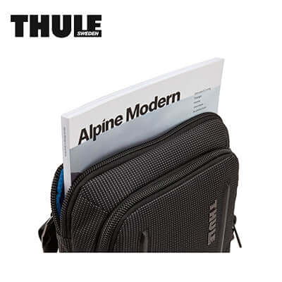 Thule Crossover 2 Crossbody Tote Sling Bag showing the front pocket with magazine, ideal for minimalists and corporate gifts.