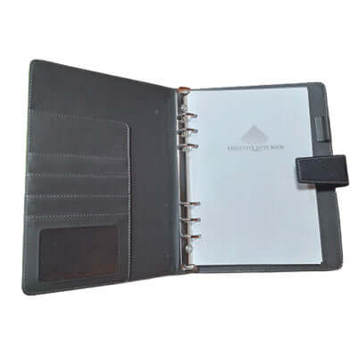 A5 PU Ring-Binder Notebook open view showing pockets and 100 sheets of paper for note-taking and organization.