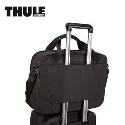 Thule Crossover 2 15.6″ Laptop Bag attached to suitcase for convenient travel.