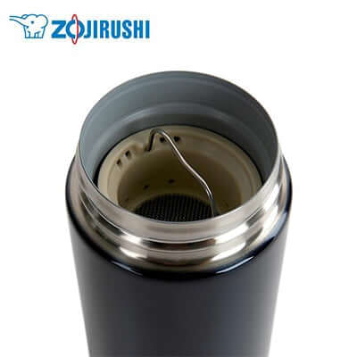 Close-up of the ZOJIRUSHI Stainless Thermal Flask showing the removable tea leaf filter and wide mouth design.