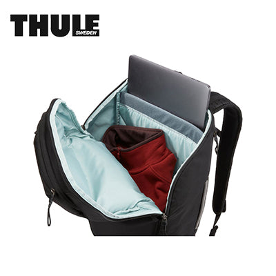 Interior view of the Thule Chasm 26L Backpack showcasing padded laptop sleeve and organized storage.