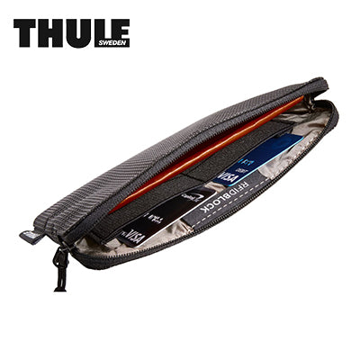 Thule Crossover 2 Multi-Purpose Travel Organizer interior with RFID-blocking features and travel wallet design.
