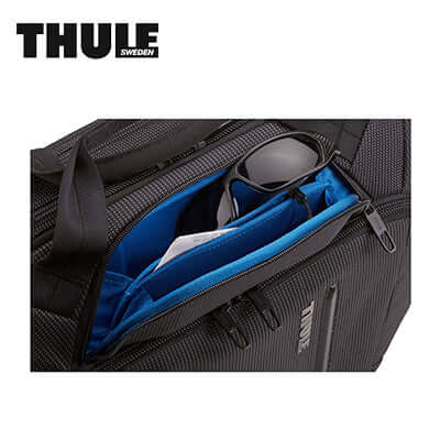 Thule Crossover 2 15.6″ Laptop Bag showing interior pockets for sunglasses and documents.