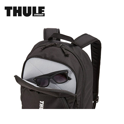 Thule Achiever 22L Laptop Backpack with sunglasses stored in front compartment, ideal corporate gift for students and professionals.