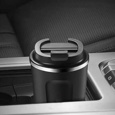 ENDO 500ML Double Stainless Steel Thermal Coffee Mug in a car cup holder with flip-to-open lid