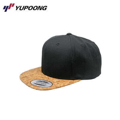 Yupoong 6089CO Premium Classic Snapback Cork with a cork peak and black fabric.