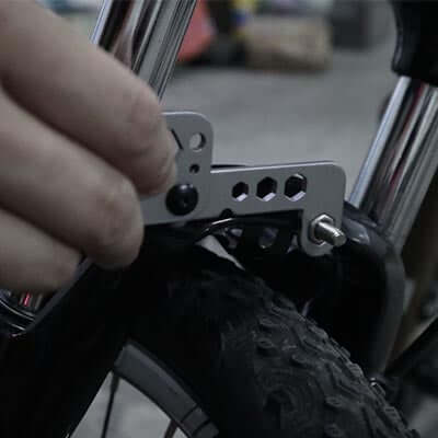 Using the BrandCharger Twist 8 in 1 Tool as a bike spoke wrench for easy bicycle maintenance.
