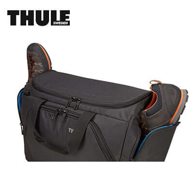 Thule Crossover 2 Duffel Bag 44L with shoes in a compartment, perfect for travel and corporate gifts.