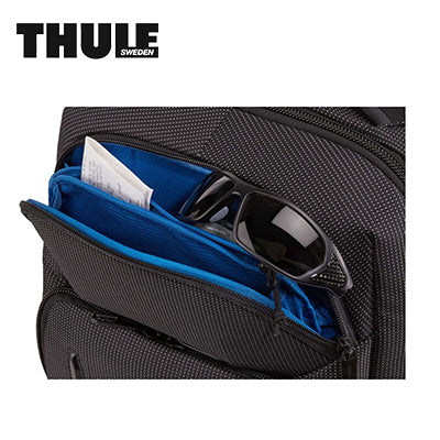 Thule Crossover 2 30L Laptop Backpack organized compartment with sunglasses and blue lining.