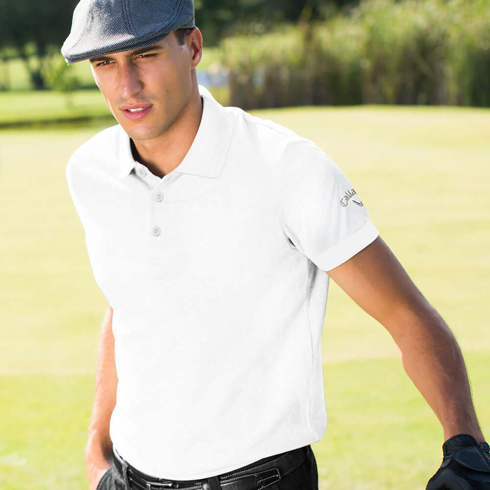 Callaway Interlock Polo Shirt worn by a man on the golf course, perfect for corporate gift occasions.