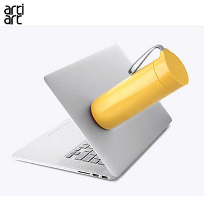 artiart Butterfly Spill Free Suction Thermal Bottle attached to a laptop, ideal for corporate gift.