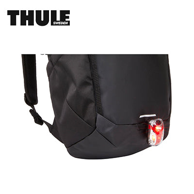 Thule Chasm 26L Backpack with a safety light attachment for visibility during outdoor adventures.