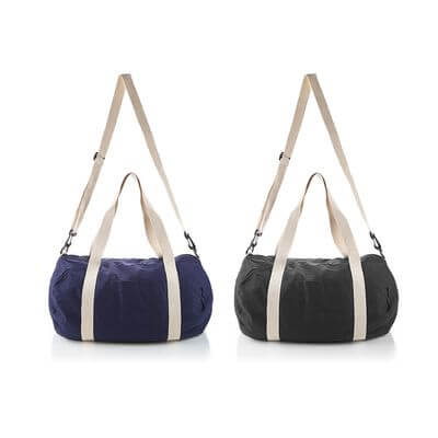 Cotton Barrel Duffel in navy and black colors with adjustable straps, perfect for travel and gym needs.